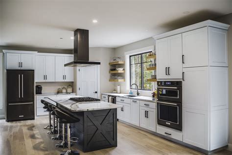 white cabinet and black stainless steel appliances|black fridge in white kitchen.